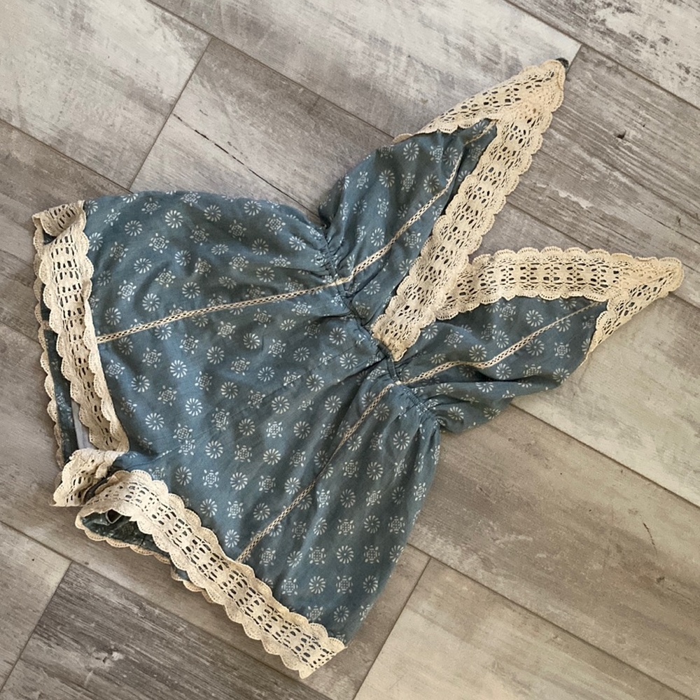 Open-back String Tie Blue Romper with Cream Lace Trim Detail